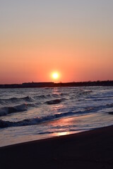 Naklejka premium Sunset sea landscape. Warm March day, calm sea.