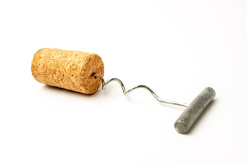 Metal corkscrew with cork isolated on white background. Wine bottle opener with cork stoppers.