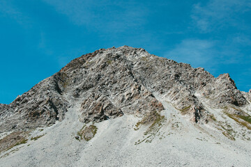 Mineral and rocky mountain in the French Alps in Pralognan from the foot of the mountain