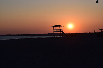 Fototapeta na wymiar Sunset sea landscape. Warm March day, calm sea.