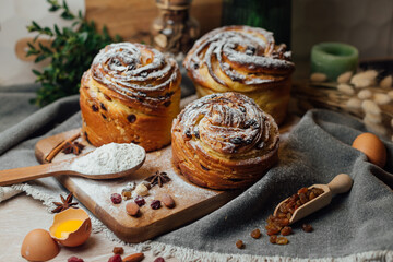 Fototapeta na wymiar Easter traditional bread cake - Kraffin, panettone decorated on kitchen table