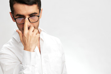 businessman portrait white shirt adjusts his glasses gesture spectacled isolated background