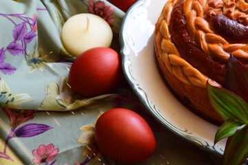 Homemade cakes for the holiday, Easter, Easter baking, bread, eggs, a candle on the table