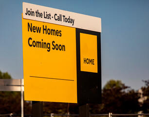 Yellow Sign Advertising New Homes being built