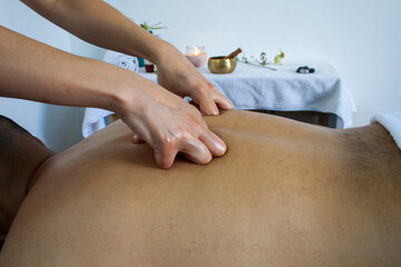 Young woman Massaging a patient