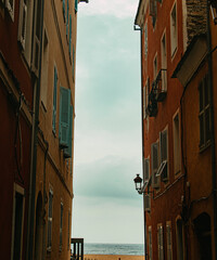 Narrow street leading to the Mediterranean Sea in Bastia, Corsica