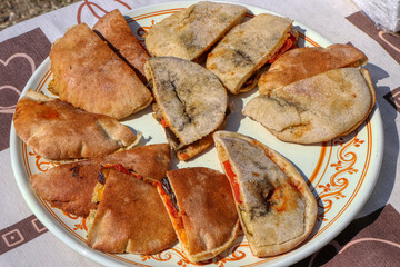 Puccia salentina with vegetables, typical of the Apulian tradition. Food of Puglia, Italy