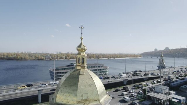 Aerial view on cupola of the church on the river background