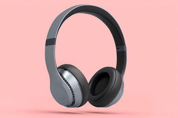 Silver gaming headphones and concept of music equipment isolated on pink.