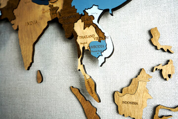 Asia on the political map. Wooden world map on the wall. Thailand, Vietnam, Indonesia, Cambodia countries