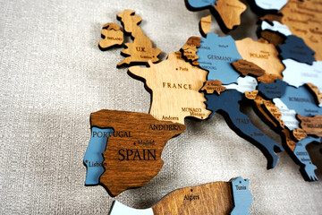 Europa on the political map. Wooden world map on the wall. Spain, France, Germany and other countries
