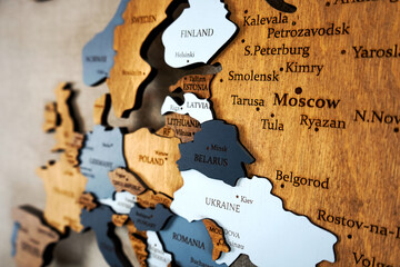 Europa on the political map. Wooden world map on the wall. Belarus, Poland, Ukraine