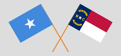 Crossed flags of The State of North Carolina and Somalia. Official colors. Correct proportion