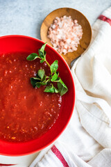 Gazpacho soup served in black bowl