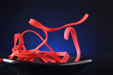 Neon fettuccine abstract close up