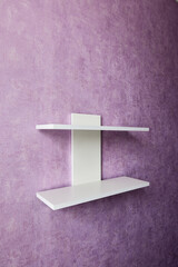 white shelf on purple wall for things and entourage. Image for sale on marketplace. Copy space