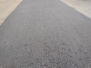 Obraz premium Brand new asphalt pavement low angle background