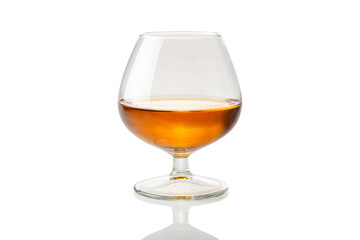 French cognac or brandy into glass called napoleon isolated on white, clipping path