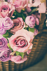 Beautiful fabric artificial flower rose bouquet background vintage tone.