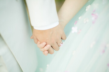 bride and groom holding hands
