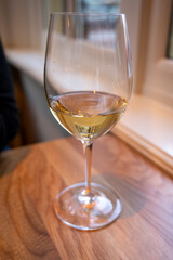 Glass of cold dry French sauvignon blanc white wine served in French restaurant