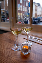 Two glasses of cold dry French sauvignon blanc white wine served in French restaurant