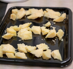 Process of making parmigiano-reggiano parmesan cheese on small cheese farm in Parma, Italy, tastig...
