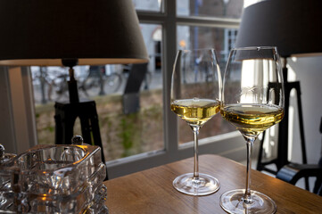 Two glasses of Chilean Chardonnay Viognier white wine served in cosy Dutch restaurant