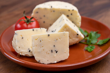 Traditional polish white cheese with black chives seeds made in North Poland in Kaszebe area near...