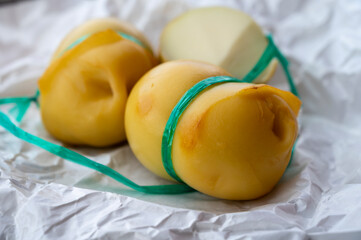Italian cheeses collection, smoked scamorza pear shaped cheese from small cheese farm in South Italy