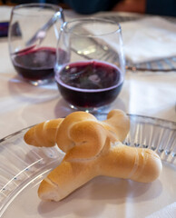 Sparkling wine of North Italy, region Emilia Romagna, red dry or sweet Lambrusco wine and bread in Modena