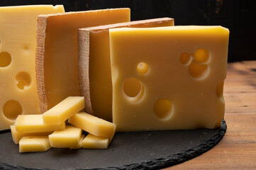 Swiss cheese collection, emmentaler with holes,  gruyere, appenzeller fondue cheeses