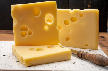 Swiss cheese collection, yellow emmentaler cheese with round holes