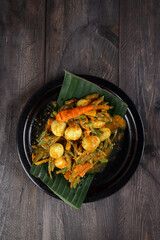 Telur Puyuh Acar Kuning or quail eggs with Pickled Vegetables, Indonesian traditional cuisine