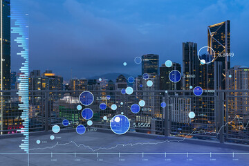 Rooftop with concrete terrace, Kuala Lumpur night skyline. Forecasting and business modeling of financial markets hologram digital charts. City downtown. Double exposure.