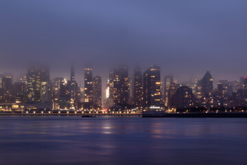 Fototapeta na wymiar Fog over the Manhattan skyline at dusk