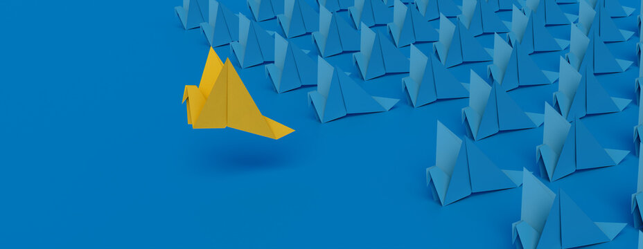 Origami Birds against a Blue background. Leadership concept with Copy Space.