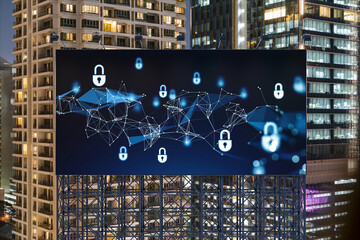 Padlock icon hologram on road billboard over panorama city view of Bangkok at night to protect business, Southeast Asia. The concept of information security shields.