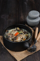 Sayur jantung pisang or spicy coocnut milk soup banana inflorescence or banana blossom. Indonesian traditional cuisine made of banana blossom.