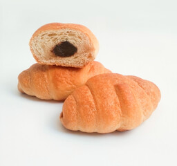 croissant with chocolate filling on white background