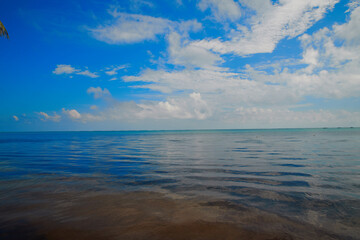 Fototapeta na wymiar blue sky with clouds over the sea