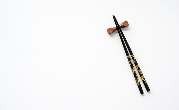 black wood chopsticks on table background,copy space