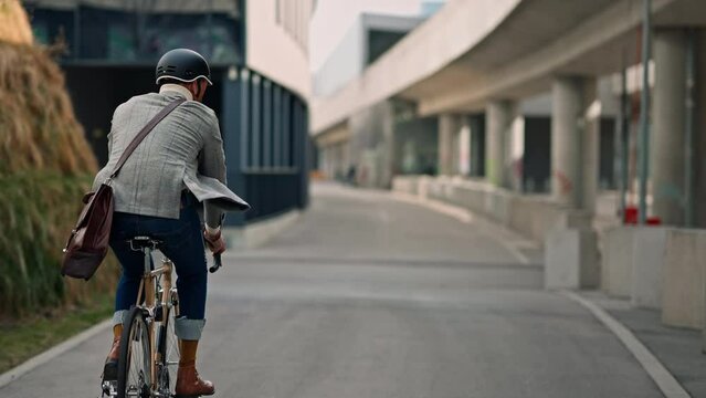 Businessman going to work on bike. Eco friendly transport
