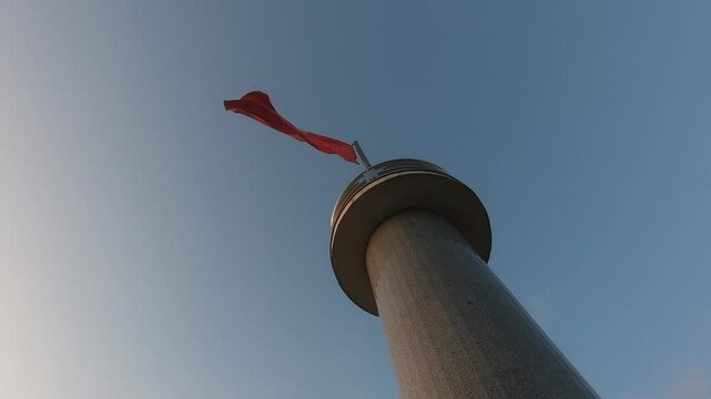 Vietnamese flag is waving on a tower