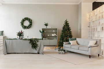 New Year's interior on a green background with a Christmas tree and a sofa