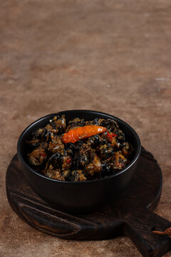 Krengsengan keong or Tumis keong is stir fry snail meat with spicy chili sauce