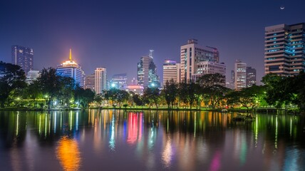 Fototapeta na wymiar Twilight evening cityscape of modern capital Bangkok city, Thailand. Building, architecture and city concept.