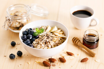 Healthy breakfast with yogurt, granola and fresh blueberries.