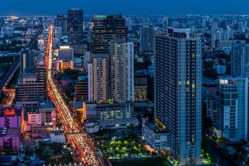 Fototapeta na wymiar Night cityscape of modern capital Bangkok city, Thailand in twilight evening. Building, architecture and city concept. 