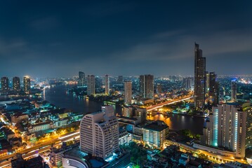 Obraz premium Night cityscape of modern capital Bangkok city, Thailand. Building, architecture and city concept. 